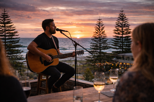 Perspective from a resident at a coastal wine bar in Fremantle Perth spectating a solo guitarist singing into a mic on a stand, while playing a Yamaha FG800 Acoustic Guitar
